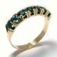 Meia Alian�a de safira azul em ouro 18k